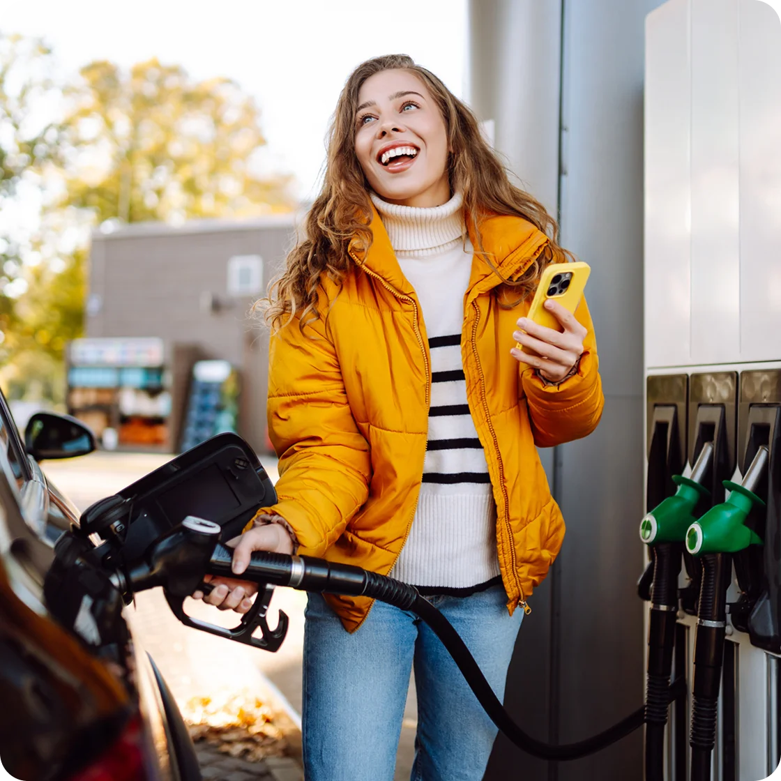 Girl with Phone on Gas Station