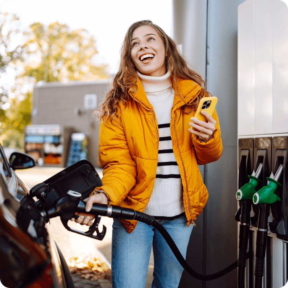 Girl with Phone on Gas Station