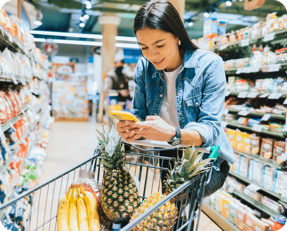 Girl in a shopping with a Phone