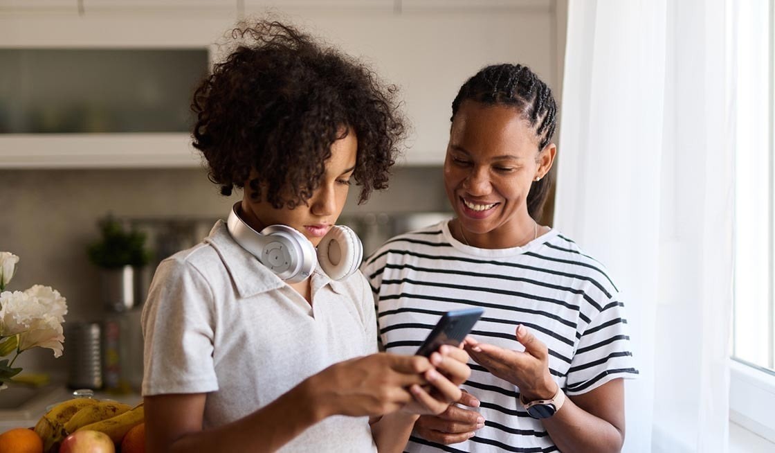 Mother and Son with a Phone